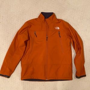 Orange North Face zip up coat